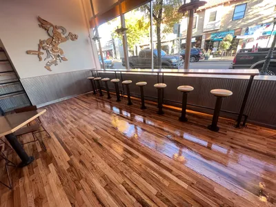 Fresh coat of epoxy resin on wood floor in restaurant